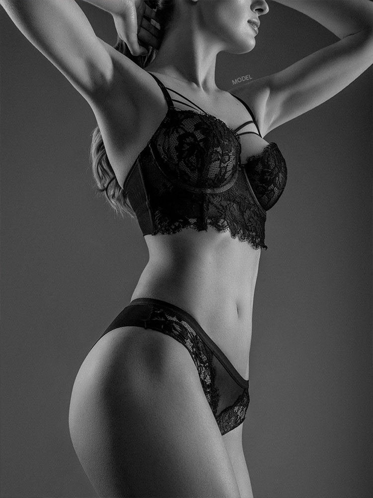 Mid body shot of a slim woman in lingerie