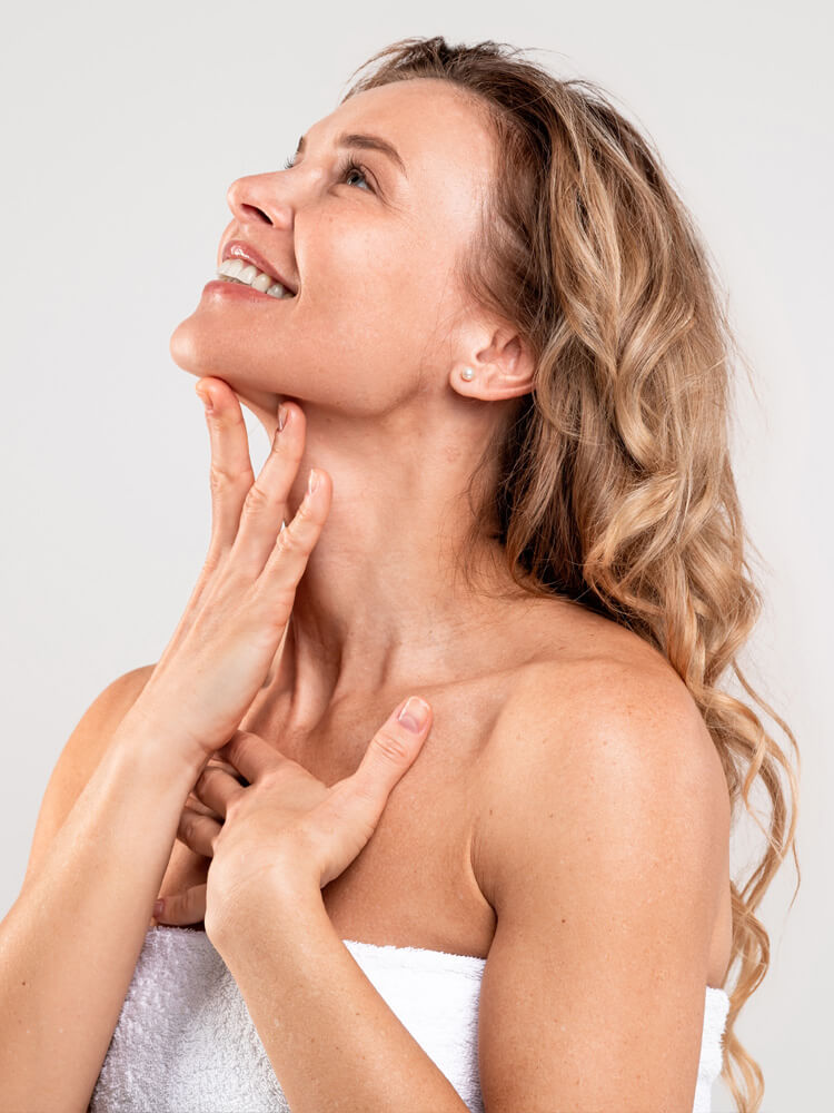 beautiful woman touching neck