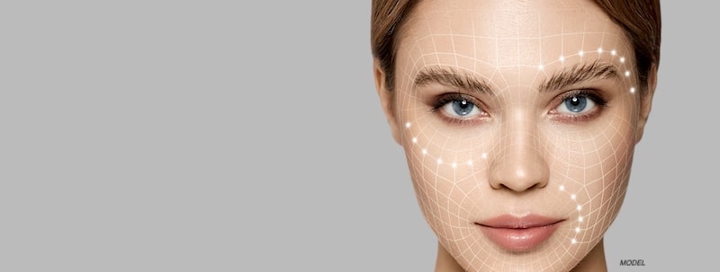 Women with lines and dots around her face. 